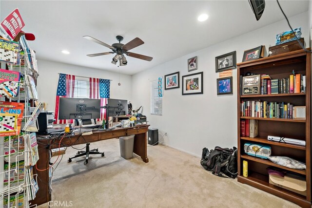 carpeted office space with a ceiling fan and recessed lighting