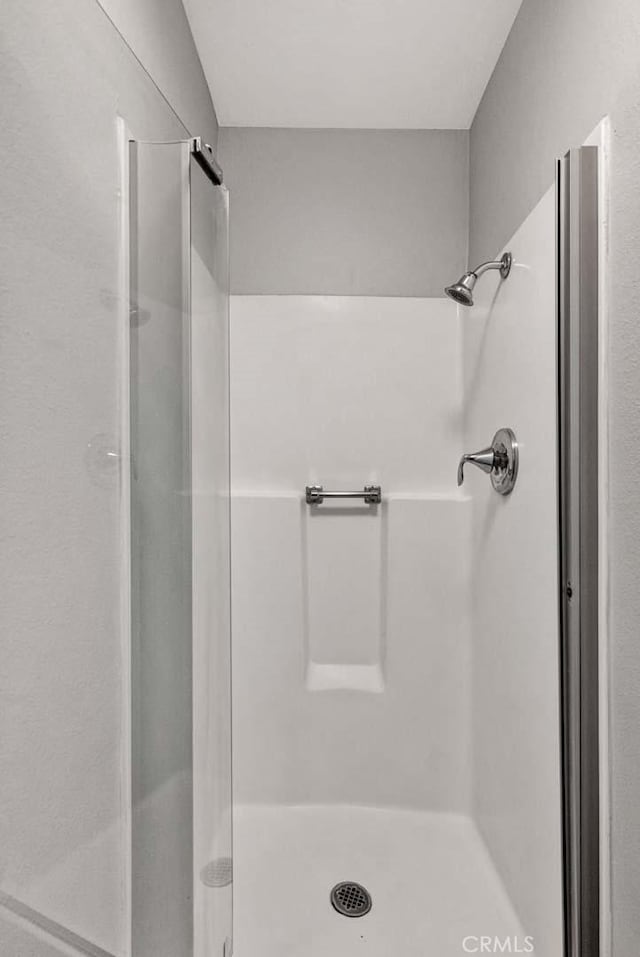 bathroom featuring a shower stall