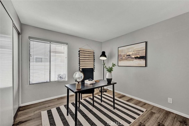 office area with wood finished floors and baseboards