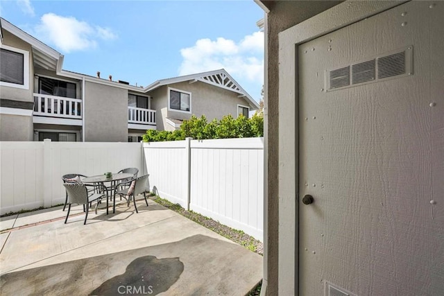 view of patio / terrace featuring outdoor dining space and a fenced backyard