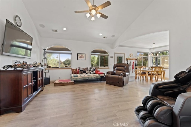 living room with high vaulted ceiling, recessed lighting, a ceiling fan, visible vents, and light wood-style floors