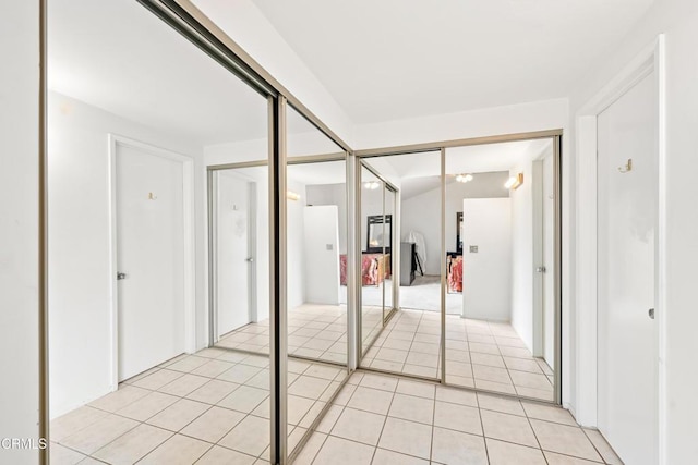 hallway featuring light tile patterned floors