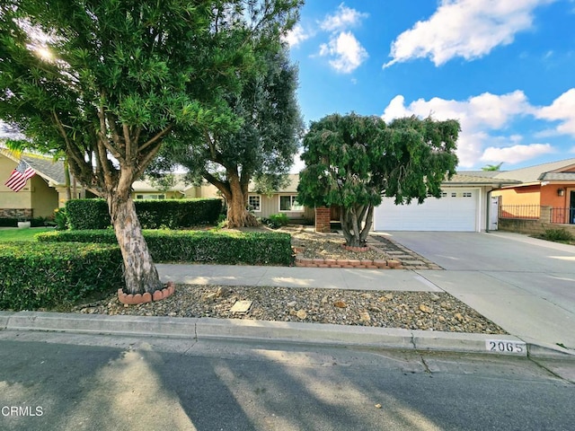 view of front of home with driveway and an attached garage