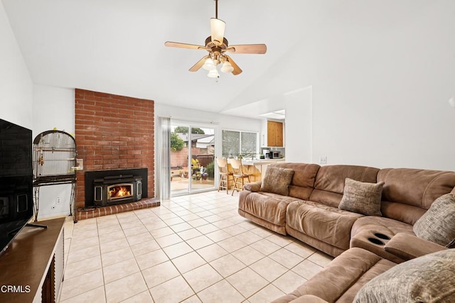 living room featuring light tile patterned floors, a fireplace, high vaulted ceiling, and a ceiling fan