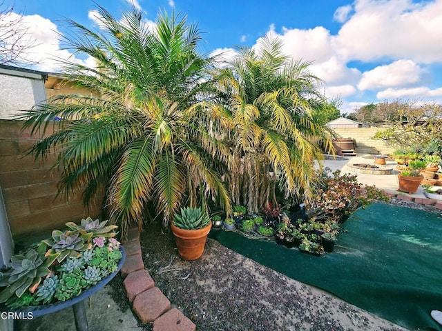 view of yard featuring fence and a patio