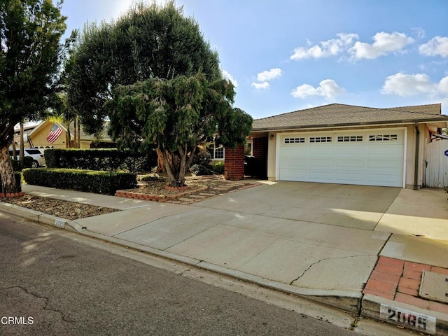 view of front of property with driveway and an attached garage