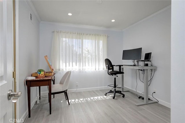 office area with visible vents, crown molding, baseboards, and wood finished floors