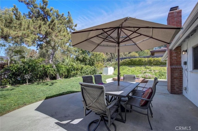 view of patio featuring outdoor dining area