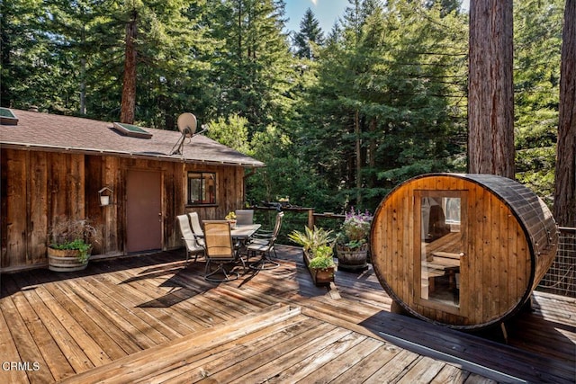 wooden deck featuring outdoor dining area