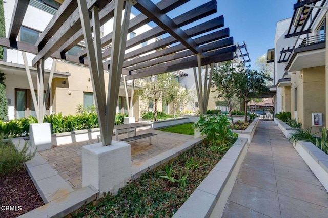 view of home's community with a pergola