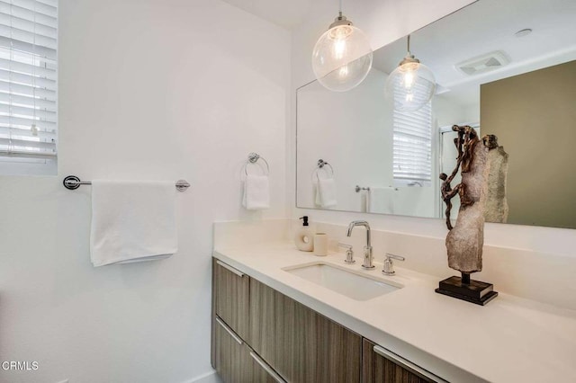 bathroom with visible vents and vanity