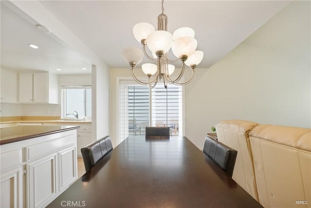 dining room featuring recessed lighting and an inviting chandelier