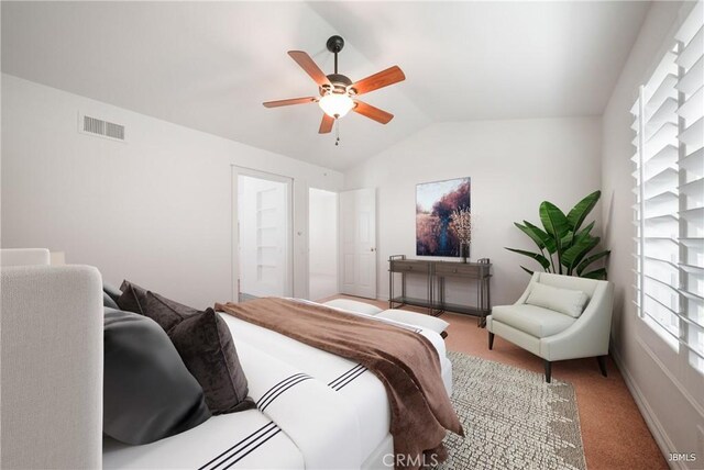 carpeted bedroom with lofted ceiling, visible vents, and a ceiling fan