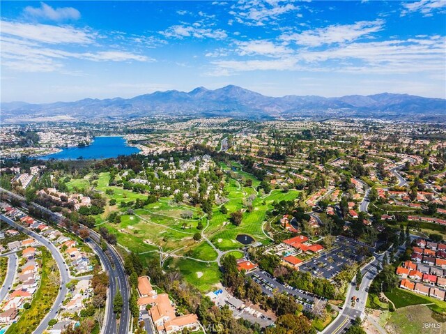 birds eye view of property featuring a water and mountain view