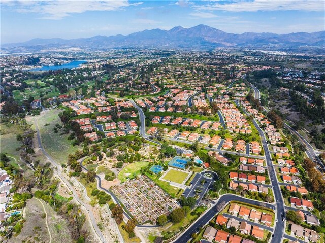 aerial view featuring a water and mountain view