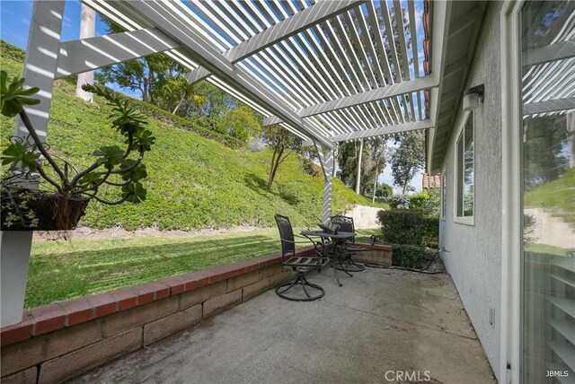 view of patio featuring a pergola