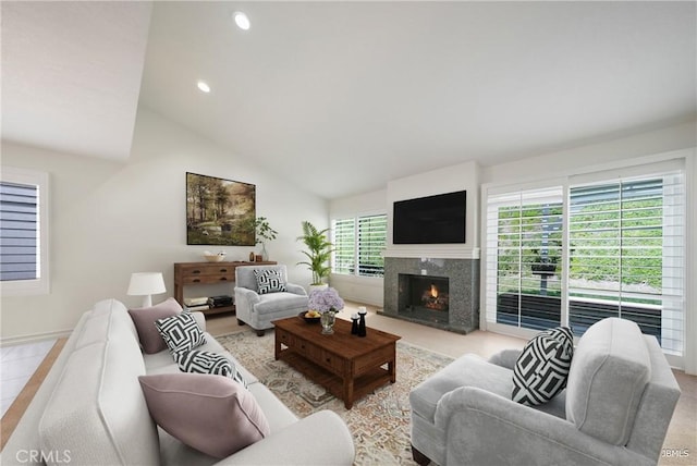 living room featuring a premium fireplace, high vaulted ceiling, and recessed lighting