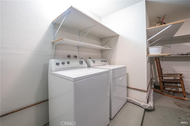 laundry room featuring laundry area and washing machine and clothes dryer