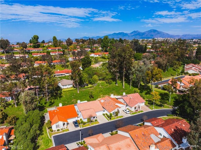 birds eye view of property with a mountain view and a residential view