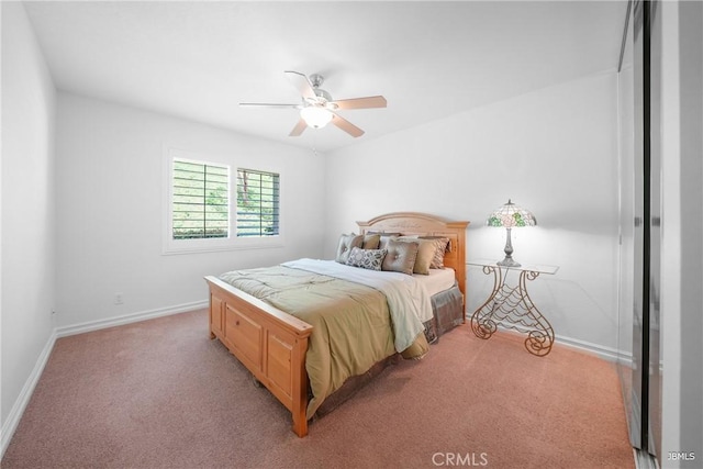 bedroom featuring light carpet, baseboards, and a ceiling fan