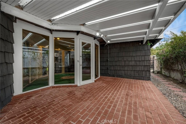 view of patio featuring fence