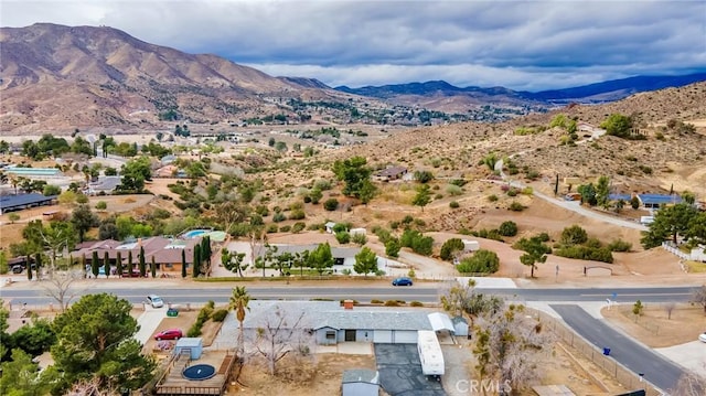 birds eye view of property with a mountain view