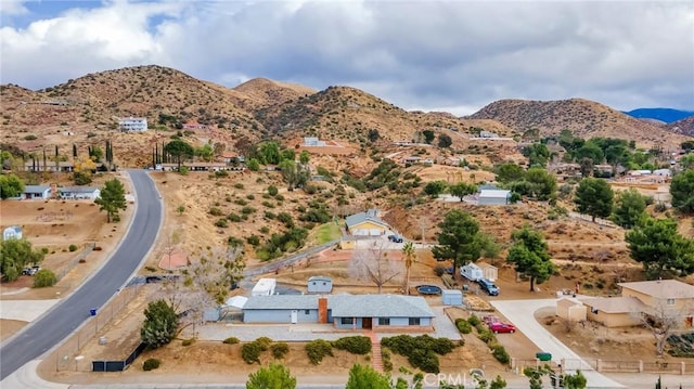 birds eye view of property with a mountain view