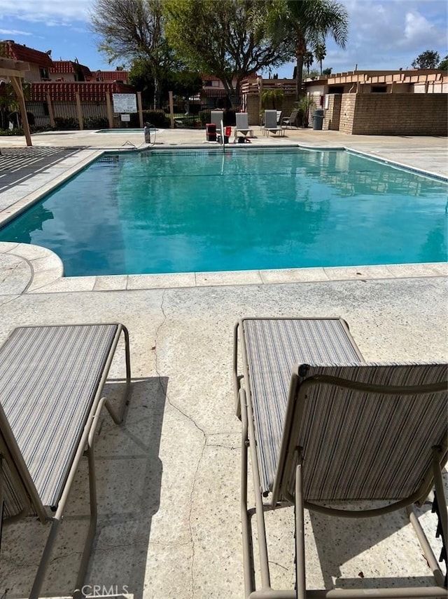 view of pool with a patio, fence, and a fenced in pool