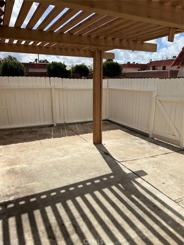 view of patio / terrace featuring fence and a pergola