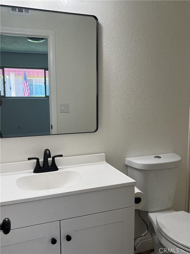 22822 Mesa Way Unit 1, Lake Forest, CA 92630 - bathroom with vanity and a textured wall
