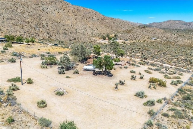 mountain view featuring view of desert and a rural view