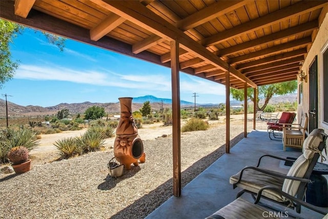 view of patio / terrace with a mountain view