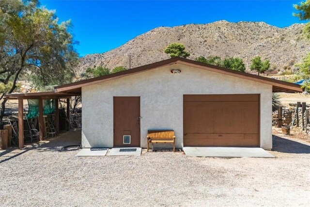 detached garage featuring a mountain view