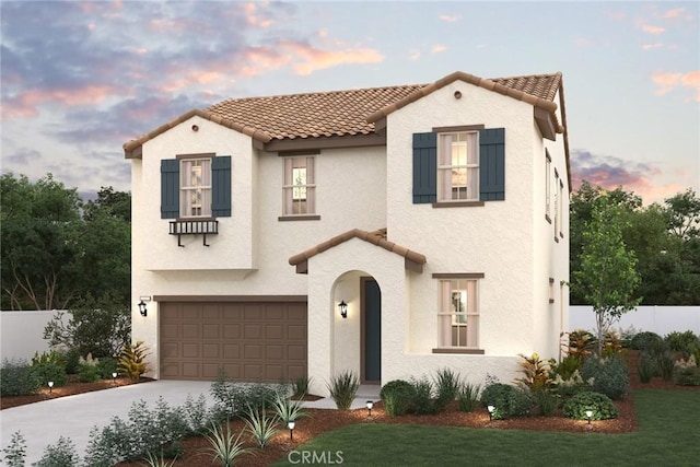 mediterranean / spanish home featuring a garage, a tile roof, and stucco siding