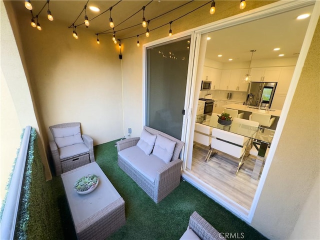 view of patio / terrace featuring an outdoor living space and a balcony