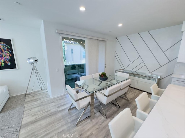 living room featuring recessed lighting, light wood-type flooring, and baseboards