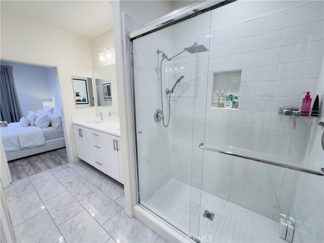 full bathroom featuring vanity, ensuite bath, and a stall shower