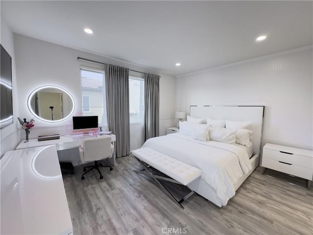 bedroom featuring recessed lighting and wood finished floors