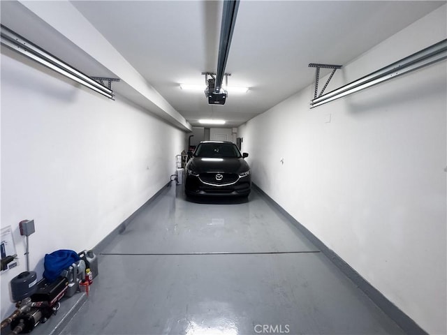 garage featuring baseboards and a garage door opener