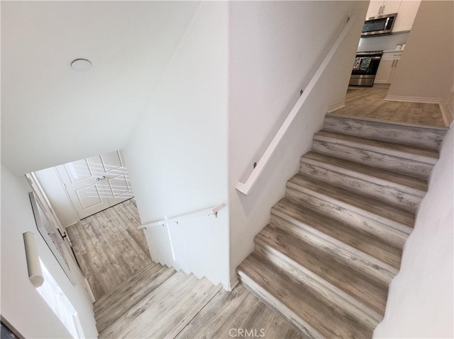 stairs with wood finished floors