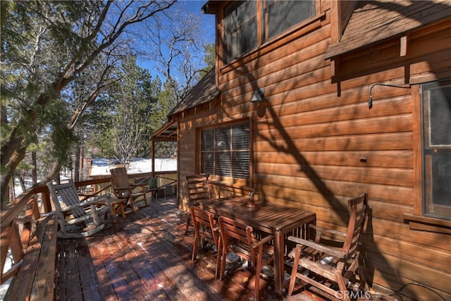 deck with outdoor dining space