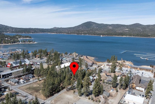 aerial view featuring a water and mountain view