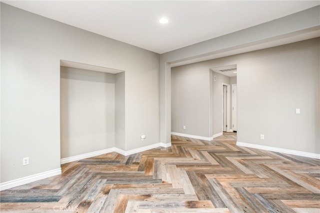 unfurnished room featuring visible vents and baseboards