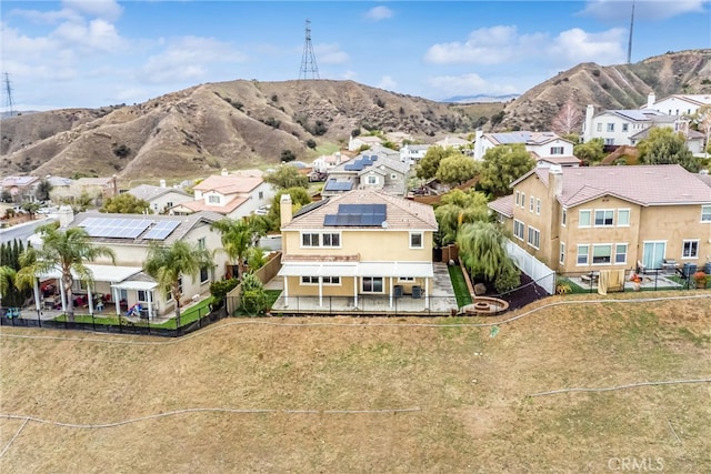 aerial view featuring a mountain view and a residential view