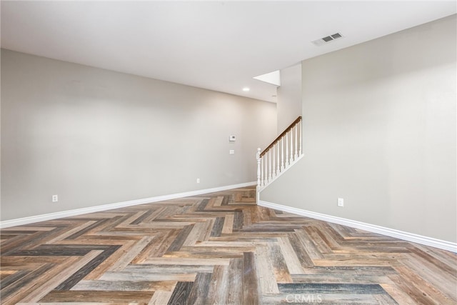 empty room featuring baseboards, stairs, visible vents, and recessed lighting