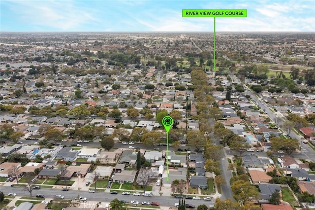 birds eye view of property with a residential view