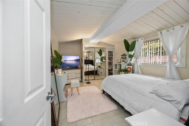 tiled bedroom with vaulted ceiling with beams and wood ceiling