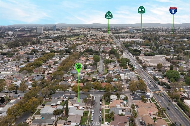 birds eye view of property with a mountain view