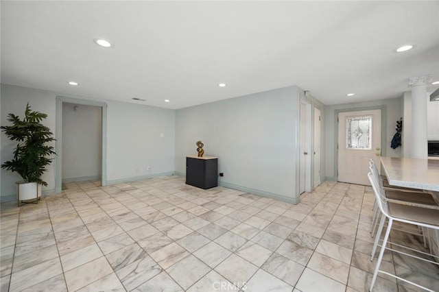 interior space with recessed lighting, baseboards, and marble finish floor