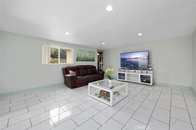 living room featuring marble finish floor, baseboards, and recessed lighting